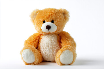 Obraz premium Plush teddy bear in soft orange color sitting against white backdrop
