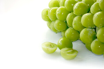 Fresh Bunches of shine muscat grapes green fresh grapes isolated on white background. Japanese grapes ripe juicy grapes.