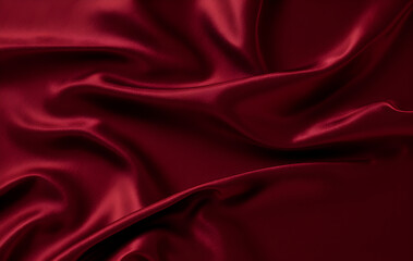 Fototapeta premium Wrinkled wine-colored fabric texture — crumpled textile background in burgundy red tone