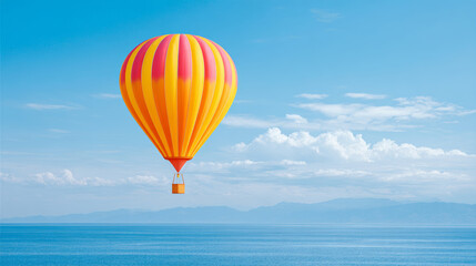 Colorful striped hot air balloon under the blue sky