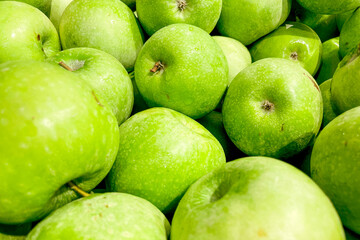 Apples in basket at grocery store, fruits and vegetables are sold at market