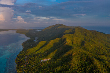Aerial view of lush green mountains and coastline