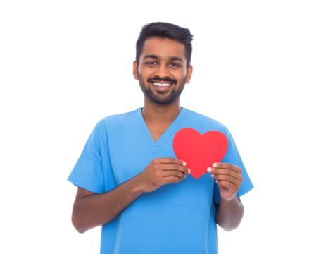 A smiling young Indian male medical professional in blue scrubs holds a vibrant red paper heart, symbolizing health, love, and dedicated care isolated on a transparent background - Powered by Adobe