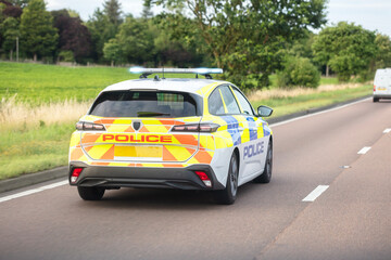 Police siren flashing blue lights on motorway driving to accident or crime scene