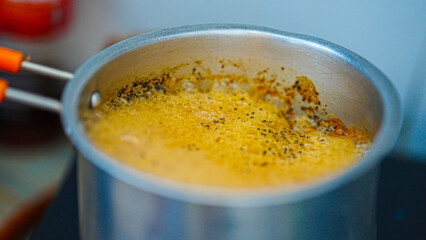 Hot Indian Masala Chai Brewing with Steam in Closeup View