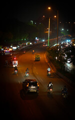 Busy Night Traffic with Motorbikes and Cars in Indian City