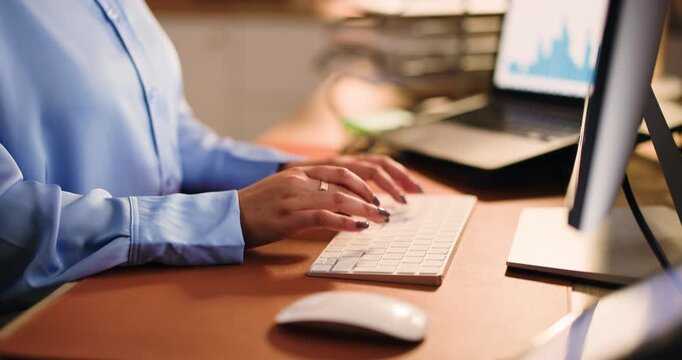 Typing, research and computer with hands of woman in office for finance graph, night or tax account report. Budget review, audit deadline and revenue analysis with person in investment firm for admin