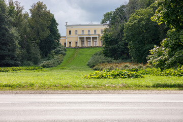 The central building of the palace in Sergievo. Summer landscape in the park.