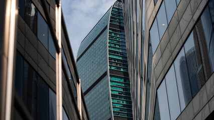 walls and empty windows of a modern building on a big city street without people