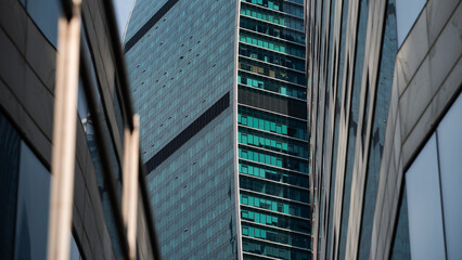 walls and empty windows of a modern building on a big city street without people