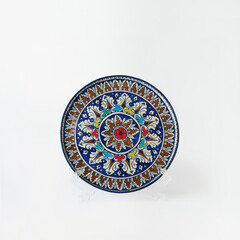 Decorative plate with floral pattern isolated on white background