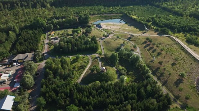 Aerial drone view of Tier-, Freizeit- und Saurierpark Germendorf, popular amusement and wildlife park in Oranienburg, Brandenburg, Germany, family attraction and leisure destination. 15 September 2024