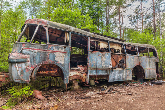 Abandoned and heavily weathered touring bus in Smaland, Sweden