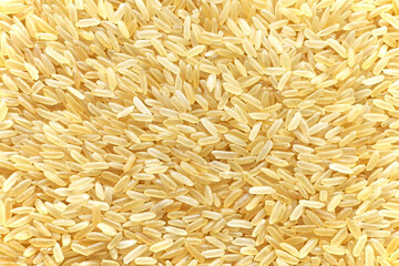 Parboiled rice texture background. Uncooked food background.