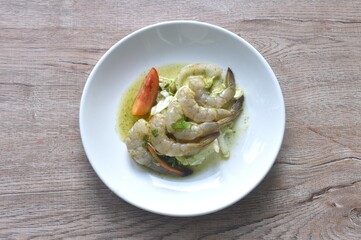raw shrimp dressings spicy sauce salad with vegetable on plate