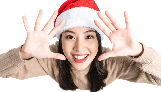 Playful Young Woman in Santa Hat with Hands Framing Face, Top-Down PNG