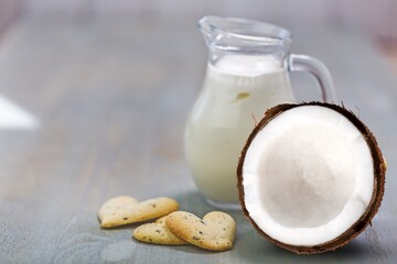 Fresh cracked or cut coconut on desk