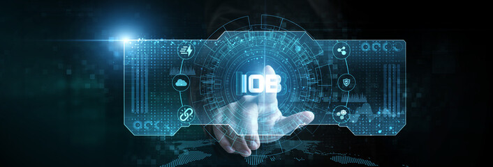 Businessman touching the IoB analytics icon on the digital screen analyzing data. consumer patterns, behavior insights, personalized marketing, predictive modeling, engagement strategies.