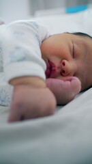 Newborn baby in deep sleep, close-up of their peaceful face gently resting on a soft bed. Tranquil expression, innocence and delicate features-SD 480p