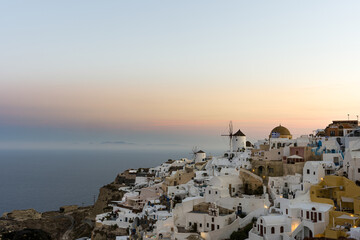 Fototapeta premium Santorini Oia Village with Windmills at Sunset