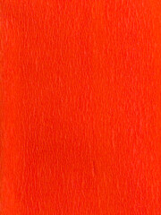 Orange textured paper background with subtle crepe pattern