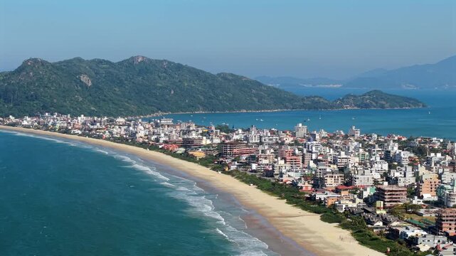 Aerial View of Mariscal and Canto Grande Beach, White Sand Coastline and Lush Green Mountains in Bombinhas, Santa Catarina, Brazil