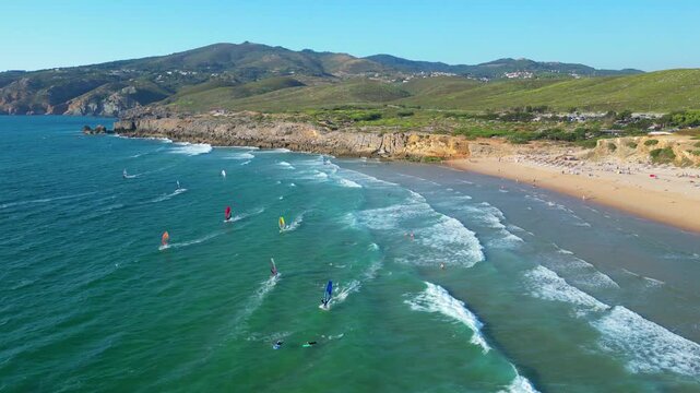 Aerial circular view from windsurfers at Guincho beach with the Serra de SIntra at background