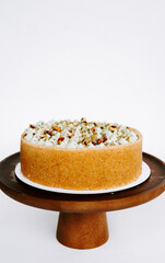 Deliciously crafted dessert on display with nuts and cream topping in a minimalist presentation