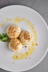 Delectable gourmet appetizer served on a white plate.