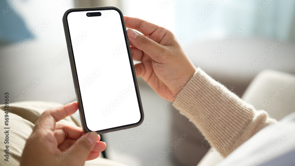 Poster hand holding modern smartphone with empty display, perfect for ui design or app presentation.