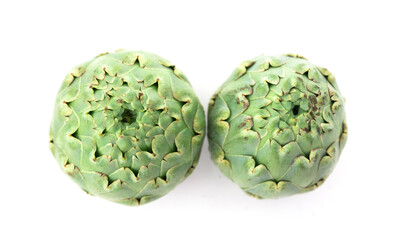 two ripe artichokes on white background