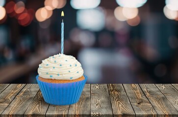 Colorful cupcake with a candle, birthday celebrations.