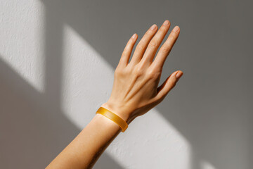 hand wearing health bracelet displays visualized metrics signifying successful workout completion