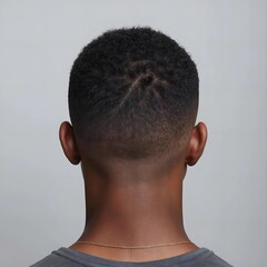 Obraz premium man's short haircut viewed from behind. The hairstyle is sleek and modern, expertly styled