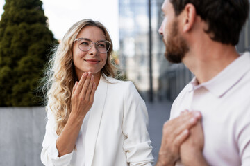 Businesswoman explaining something using sign language to her colleague