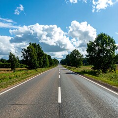 Empty road stretches into a bright sky