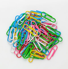 Colorful Paper Clips Piled Together on White Background