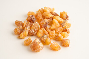 Frankincense or olibanum aromatic resin isolated on white background used in incense and perfumes.
