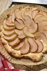 Close up freshly baked pear pie on a rack