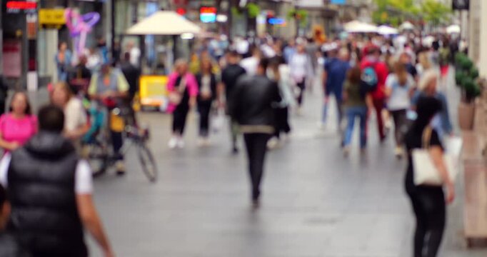 In vibrant heart of Belgrade's city center, Knez Mihailova Street is bustling pedestrian thoroughfare captured in blurred view. Historic street crowded with tourists and locals alike