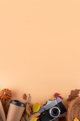 Fototapeta premium Comfortable autumn leisure background with fall decor and photo camera