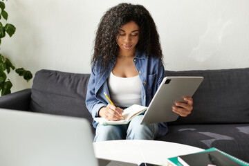 Freelance work in a modern apartment by a young African American woman