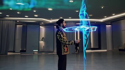 Man in ornate jacket demonstrates advanced holographic technology in a modern space
