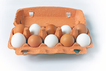 Raw Eggs in Сardboard Сontainer on White Background.