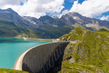 Mooserboden Staudamm in Austria beautiful alpine lakes stunning landscape. Austrian Alps in Salzburg Kaprun hiking trail scenic photo of two mountain lakes with turquoise water in the Alps from above