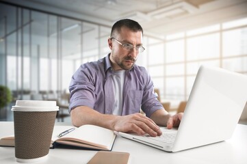 Pensive young business man manager working in office
