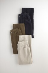 Stacked corduroy pants in neutral tones for fashion and style concepts