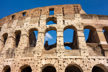 Obraz premium The Colosseum in Rome, Italy. The Amphitheatre is one of Rome's most popular tourist attractions. Italian Historical Landmark and Travel Destination