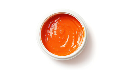 Close up of a white bowl filled with a bright orange liquid substance