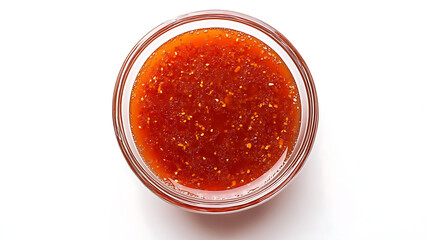 Overhead view of sweet chili sauce in a clear glass bowl on white table